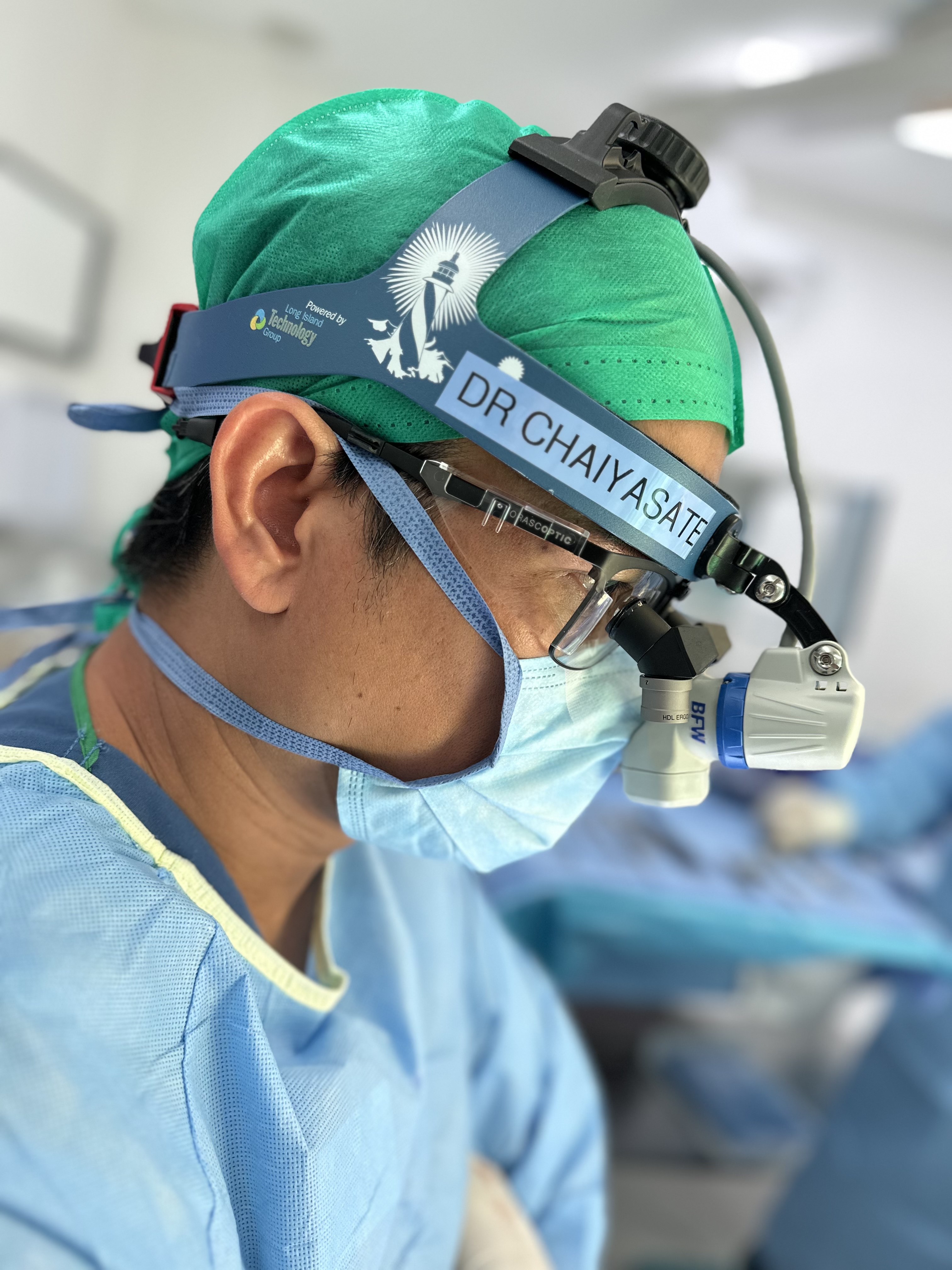 Dr. Kongkrit Chaiyasate, MD, FACS — Plastic Surgeon in the operating room, Bloomfield Hills Michigan